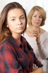 Bored Teenage Girl Being Told Off By Mother