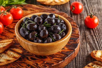 Fresh olives with toasted baguette.