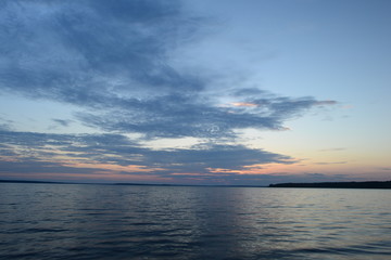 Leading lines at sunset on the water surface to infinity