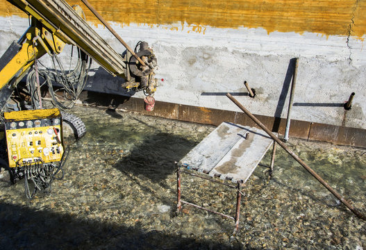  Construction Site, Construction Machinery. Consolidation Of A Wall, River Embankment