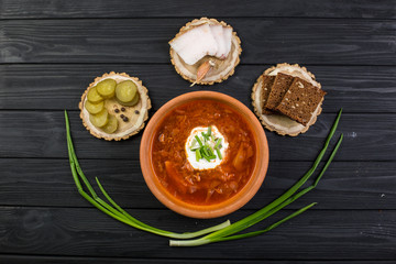 Borsch soup on the dark wood table