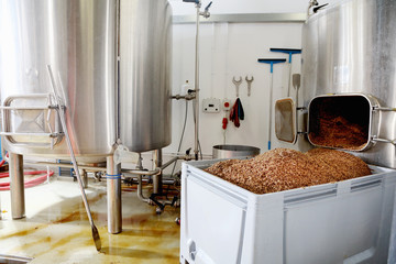 Spent grains from mash tun in large container