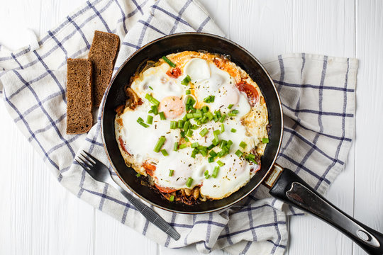 Breakfast on the table: a fried egg in  frying pan