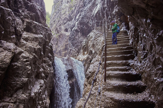 Young boy standing on stone steps, looking at view, H&iacute;_llental, Zugspitze, Garmisch-Partenkirchen, Bavaria, Germany