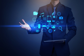 Close up of businessman playing multimedia with social media ico