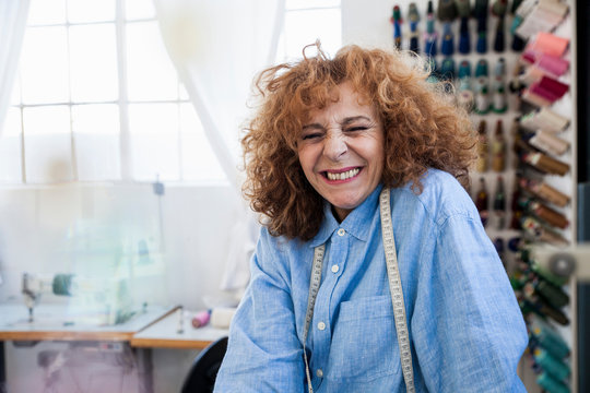 Seamstress looking at camera smiling