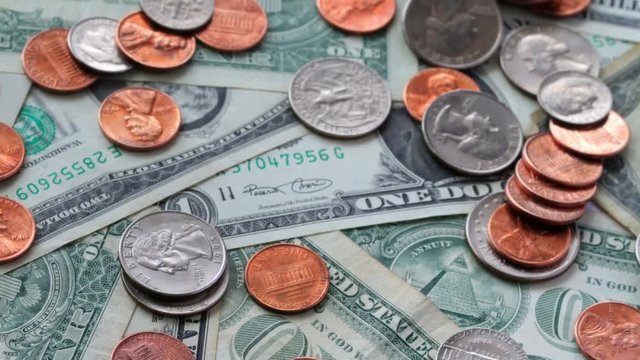 A Pile Of Coins And Cash. Shot Slider.