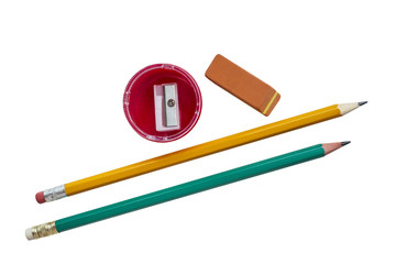 Stationery: pencils, eraser, sharpener on white background top view