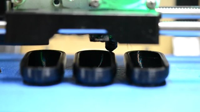 3D printer while printing form black closeup. With sound