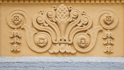 Fretwork on the building wall.