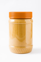 Creamy peanut butter jar isolated on white background
