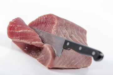Fresh big raw fillet steak slices of Tuna for BBQ barbecue or Christmas Party on white background...