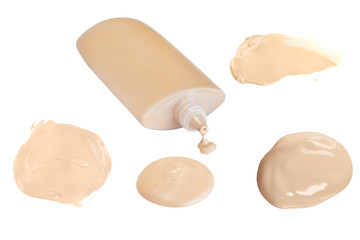 Four face make-up liquid foundation samples on a white background, and a dripping plastic container without shadow, clipping path included