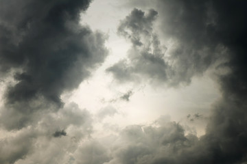 Naklejka na ściany i meble Dramatic dark sky and black cloud for background