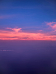 ariel view of clouds and sky in sunset above city