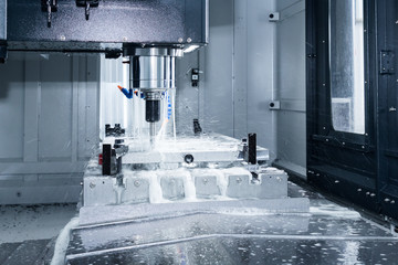 High precision CNC machining center working, operator machining