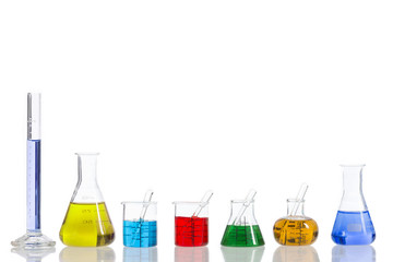 Various laboratory flasks with a colored reagents, pipette