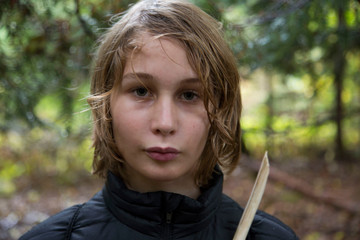 Portrait of young boy in rural setting