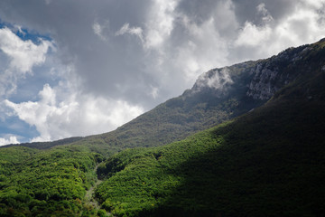 Fototapeta na wymiar High mountain at cloudy daytime. Beautiful nature landscape
