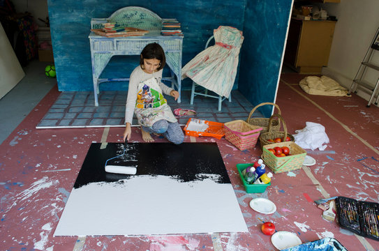 Girl in garage creating set design