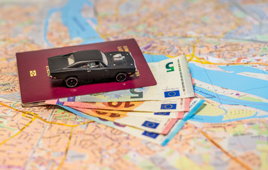 Abstract - car, money and map - ready to travel