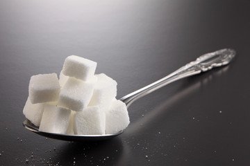 giant spoon with cube sugar