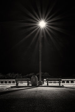 Pair Of Park Benches Under A Street Light At Seaside, Oregon At The Start Of Yet Another Wind And Rain Storm 