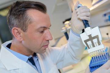 happy young male researcher working in his lab