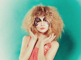 beutiful girl with creative make up like butterfly. Woman in polka dot
