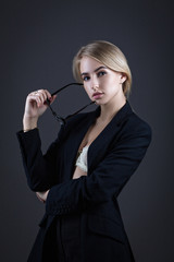 Obraz premium Secretary wearing glasses and a jacket