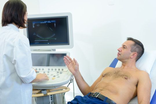Man having scan talking to nurse
