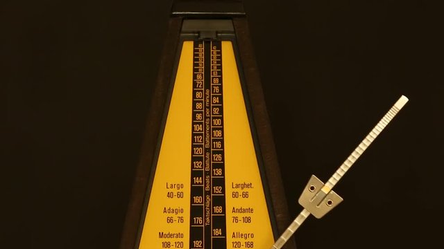 metronome on a black background