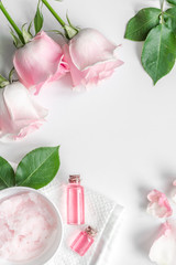 organic cosmetic with rose oil on white background top view