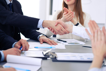Close up of  two business man shaking hands to each other finishing up the meeting