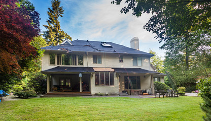 Suburban home in the middle of roof replacement. Old cedar shakes removed.