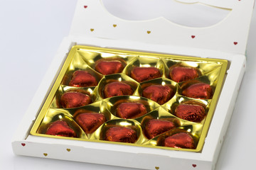 a box of chocolates in the shape of hearts