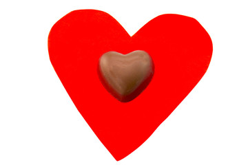 candy is lying on a red heart