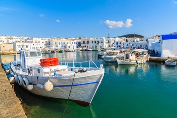 Fototapeta na wymiar Fishing boats mooring in Naoussa port on Paros island, Greece