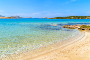 View of beautiful sandy beach with azure sea water on coast of Paros island, Greece