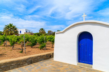 Typical Greek white church in vineyards of Ampelas village, Paros island, Greece