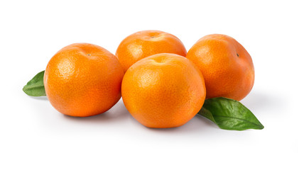 Ripe mandarin with leaves close-up on a white background.