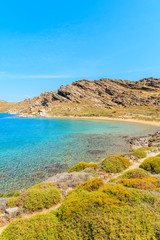 Beautiful coastal path along crystal clear sea water in Monastiri bay on Paros island, Greece