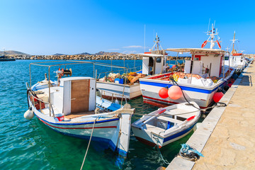 Fototapeta na wymiar Fishing boats mooring in Naoussa port, Paros island, Greece