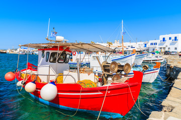 Red fishing boat mooring in Naoussa port, Paros island, Greece - obrazy, fototapety, plakaty