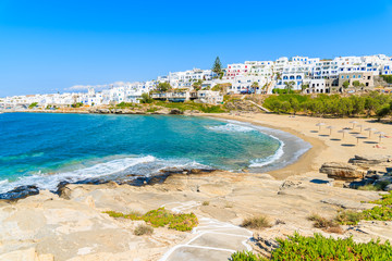 Path to beautiful sea bay with beach in Naoussa town, Paros island, Greece - obrazy, fototapety, plakaty