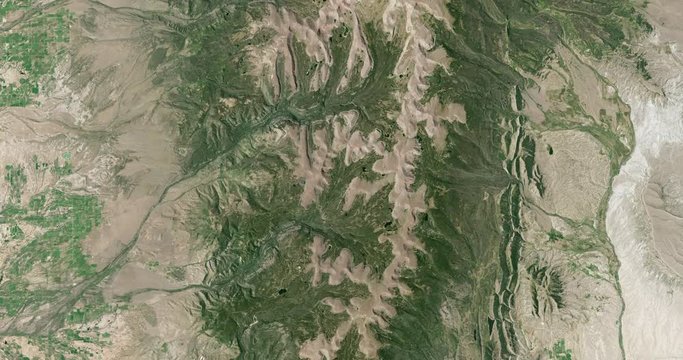 High-altitude overflight aerial of the Uinta Mountain Range, Utah. Clip loops and is reversible. Elements of this image furnished by USGS/NASA Landsat