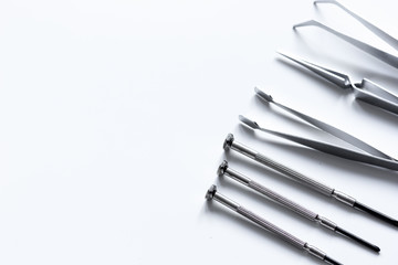 tools for repairing gadgets on white background top view