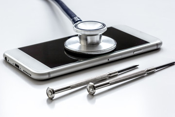 diagnostic of gadgets on white background with stethoscope