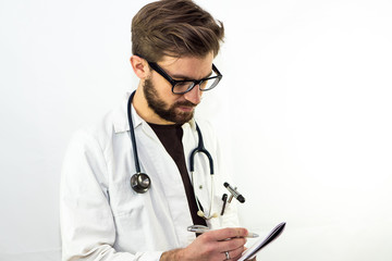 Young Male Doctor taking notes