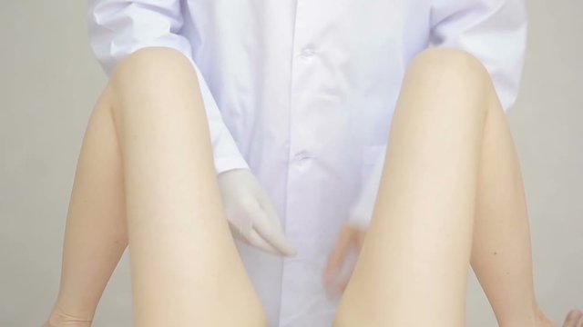 Doctor gynecologist performing an examination